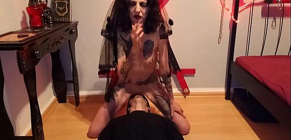  Licking blasphemic whore, while she smokes and rides a crucifix dildo